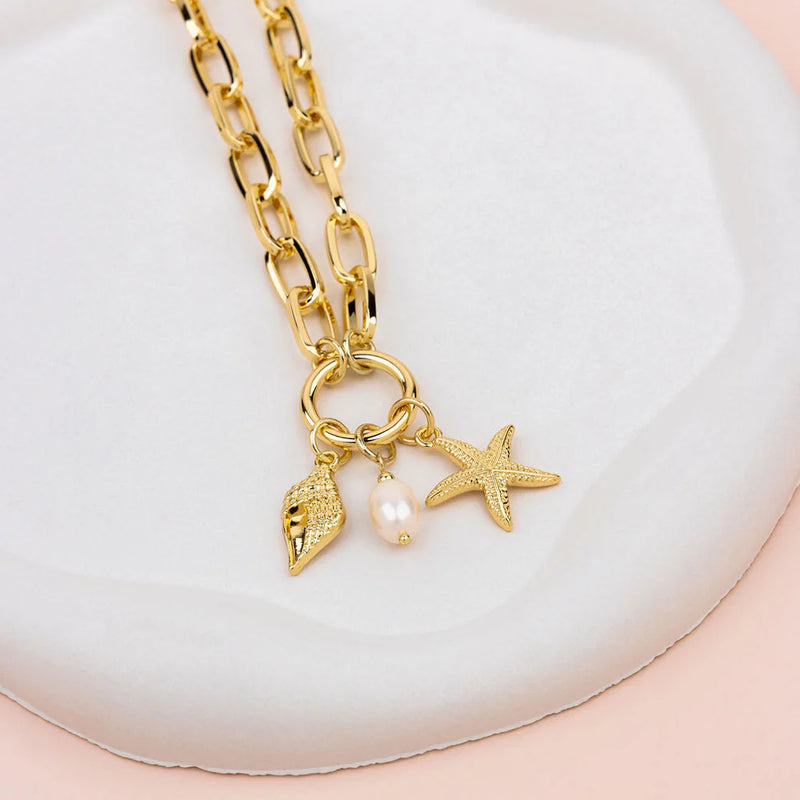 GOLD OCEAN CHARM NECKLACE